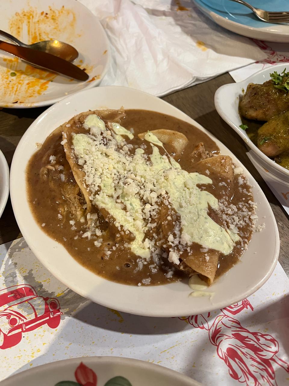 Assorted Mexican dishes on colorful plates